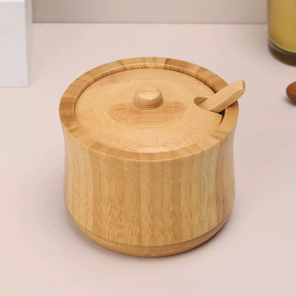 Natural bamboo sugar pot with matching lid and spoon for storing sugar, salt, spices and seasonings on kitchen counters and dining tables. bamboo sugar pot bamboo sugar bowl sugar bowl with lid and spoon wooden sugar bowl bamboo sugar container wooden spice container sugar storage container bamboo salt container bamboo kitchen storage bamboo sugar pot Pakistan